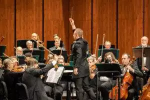 Wojciech Milewski, music director, conducting the Summerville Orchestra